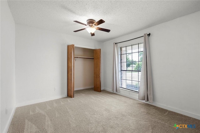 8704 Trailridge Dr, Temple, TX 76502 - unfurnished bedroom featuring carpet, a textured ceiling, a closet, and ceiling fan