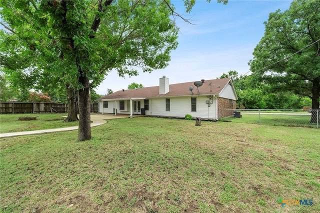8704 Trailridge Dr, Temple, TX 76502 - back of house with a fenced backyard, a patio, and a chimney