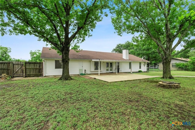 8704 Trailridge Dr, Temple, TX 76502 - rear view of house with a gate, a patio, a chimney, and french doors
