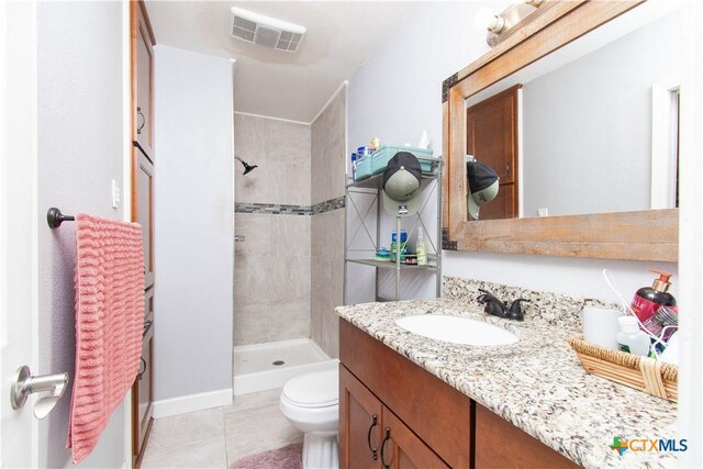 2206 Grandon Cir, Killeen, TX 76541 - bathroom featuring tile patterned floors, toilet, vanity, a shower stall, and visible vents