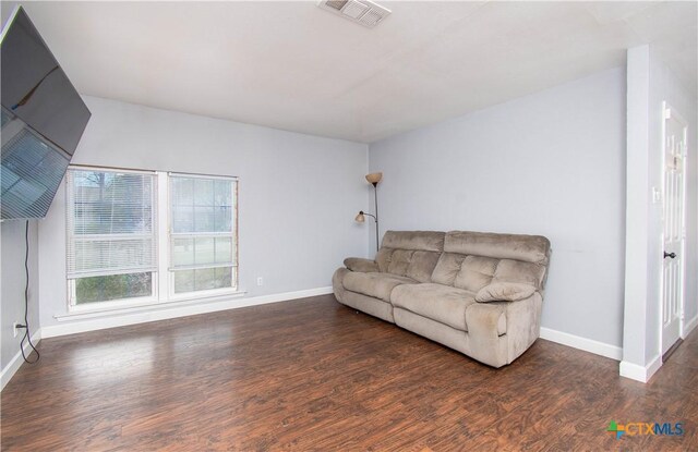 2206 Grandon Cir, Killeen, TX 76541 - living area with wood finished floors, baseboards, and visible vents