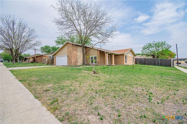 2206 Grandon Cir, Killeen, TX 76541 - view of front facade with driveway, a garage, fence, and a front lawn