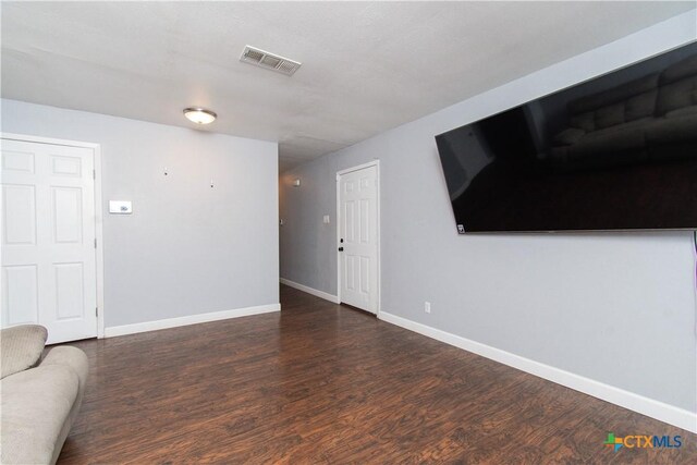 2206 Grandon Cir, Killeen, TX 76541 - unfurnished living room with baseboards, visible vents, and wood finished floors