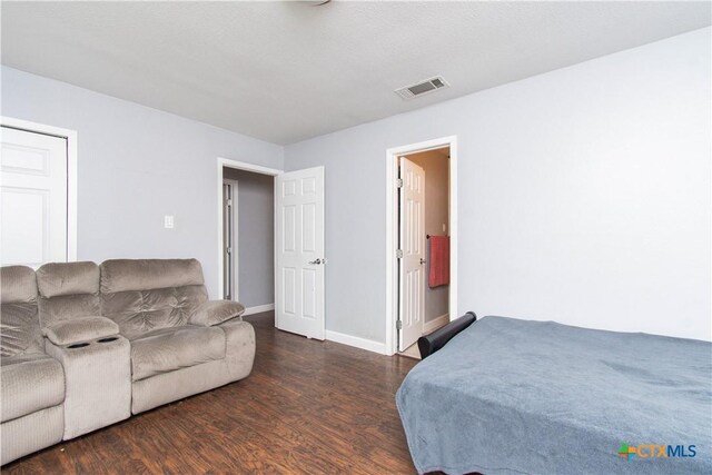 2206 Grandon Cir, Killeen, TX 76541 - bedroom featuring baseboards, visible vents, and wood finished floors