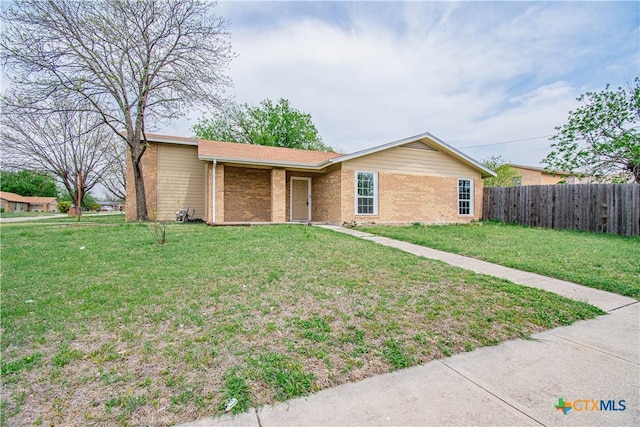 2206 Grandon Cir, Killeen, TX 76541 - single story home featuring brick siding, a front yard, and fence