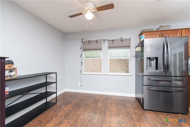 2206 Grandon Cir, Killeen, TX 76541 - kitchen with dark wood-style flooring, stainless steel fridge, baseboards, a ceiling fan, and brown cabinetry