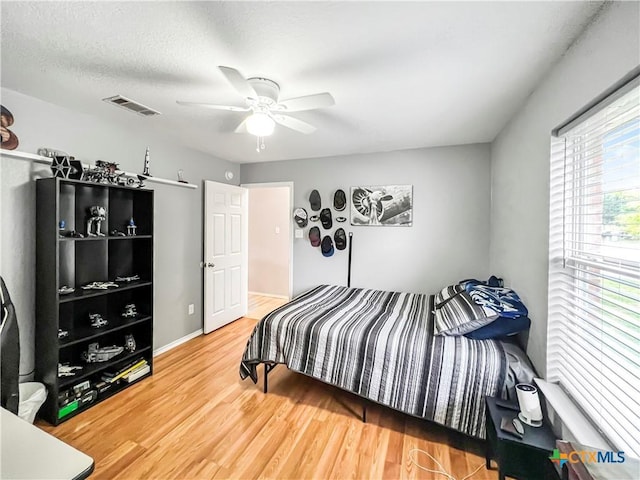 144 Calcite Ln, Jarrell, TX 76537 - bedroom featuring wood finished floors and ceiling fan