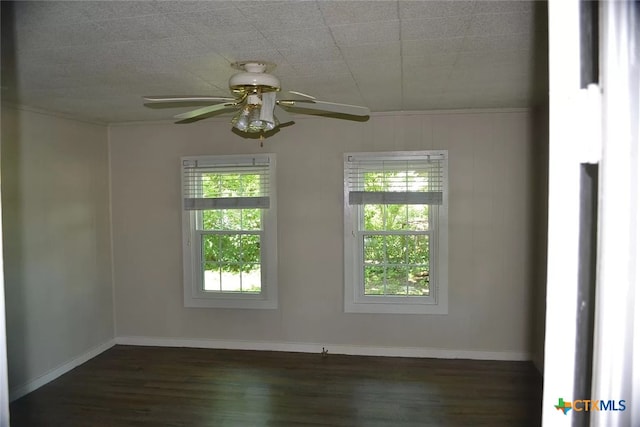 408 E N Ave, Lampasas, TX 76550 - spare room with ceiling fan, dark wood finished floors, and baseboards