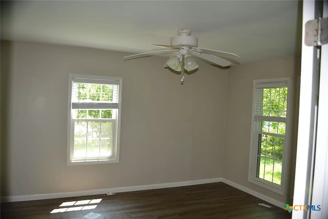 408 E N Ave, Lampasas, TX 76550 - empty room with baseboards, ceiling fan, and dark wood-type flooring