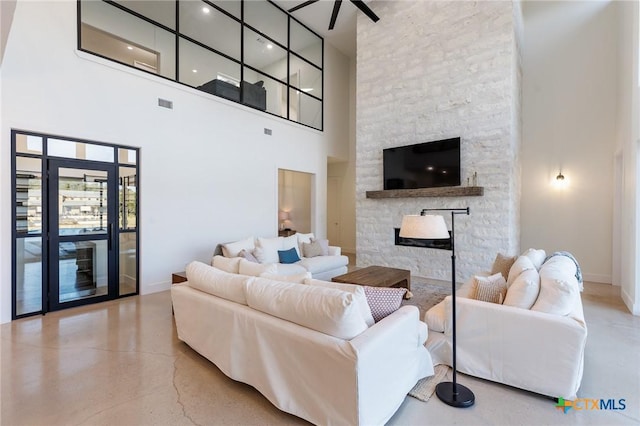 living room featuring a towering ceiling