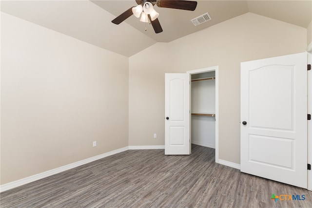 unfurnished bedroom featuring lofted ceiling, hardwood / wood-style flooring, and ceiling fan