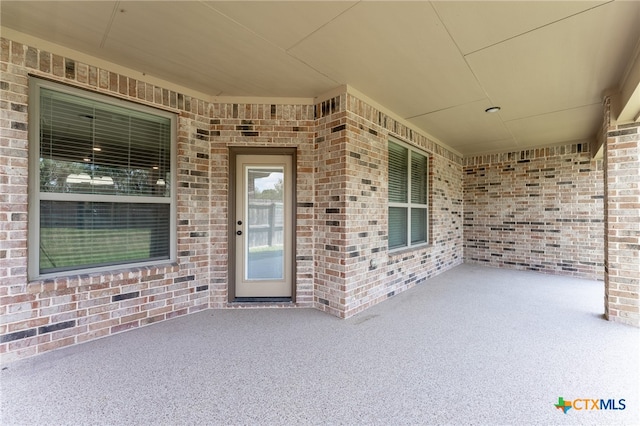 property entrance featuring a patio area