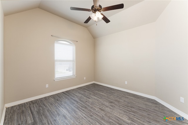 unfurnished room featuring dark hardwood / wood-style floors, ceiling fan, and vaulted ceiling