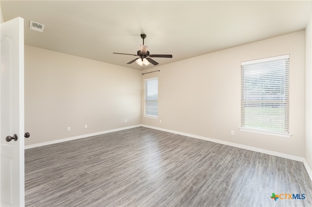 empty room featuring wood-type flooring and ceiling fan