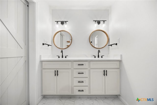 921 Indian Trl, Harker Heights, TX 76548 - bathroom featuring marble finish flooring, double vanity, and baseboards
