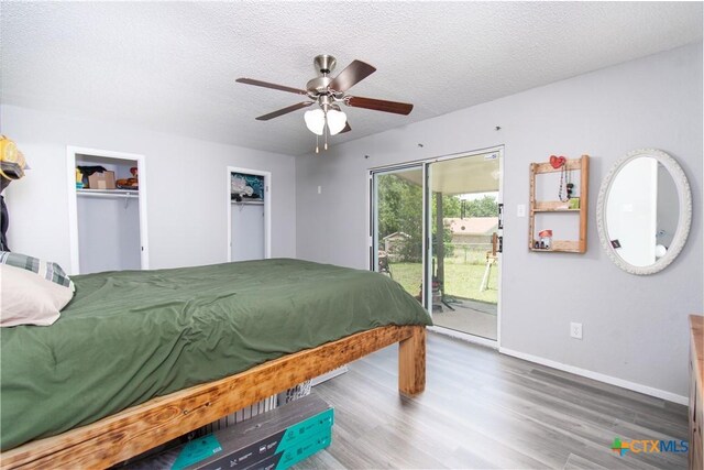 3605 Pleasing Cir, Killeen, TX 76542 - bedroom featuring access to exterior, wood finished floors, a textured ceiling, and ceiling fan
