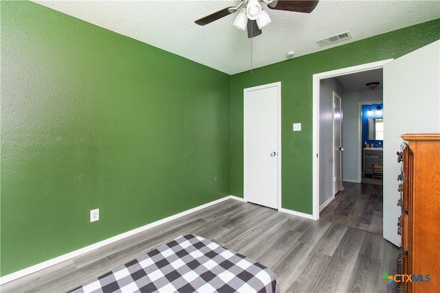 3605 Pleasing Cir, Killeen, TX 76542 - unfurnished bedroom with wood finished floors, a textured ceiling, and a ceiling fan