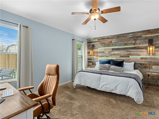 2416 Kolton St, New Braunfels, TX 78130 - bedroom featuring wood walls, carpet floors, lofted ceiling, an office area, and a ceiling fan