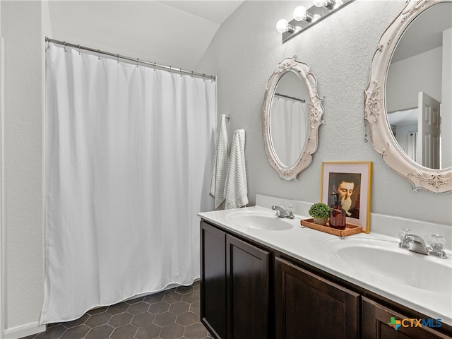 2416 Kolton St, New Braunfels, TX 78130 - full bath featuring double vanity, tile patterned floors, and curtained shower
