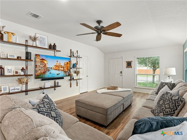 2416 Kolton St, New Braunfels, TX 78130 - living room featuring wood finished floors, a ceiling fan, and vaulted ceiling