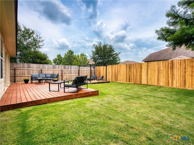 2416 Kolton St, New Braunfels, TX 78130 - fenced backyard with outdoor lounge area and a wooden deck