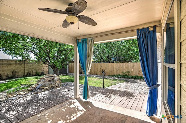 1900 Rutherford Dr, Leander, TX 78641 - fenced backyard featuring a wooden deck and a ceiling fan