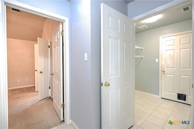1900 Rutherford Dr, Leander, TX 78641 - hallway featuring light tile patterned flooring and baseboards