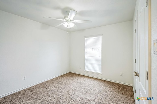 carpeted empty room with ceiling fan