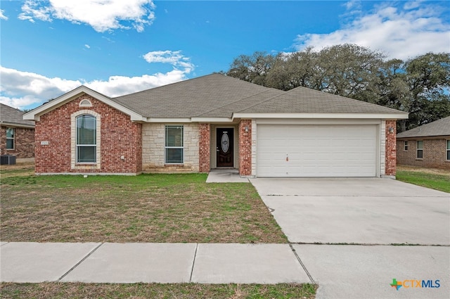 ranch-style house with a garage, central AC unit, and a front lawn