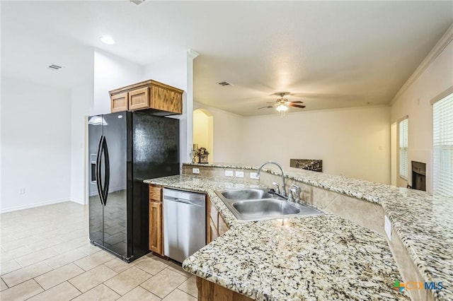 kitchen featuring black refrigerator with ice dispenser, dishwasher, sink, and kitchen peninsula