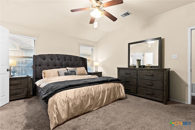 bedroom with light colored carpet, ceiling fan, and lofted ceiling