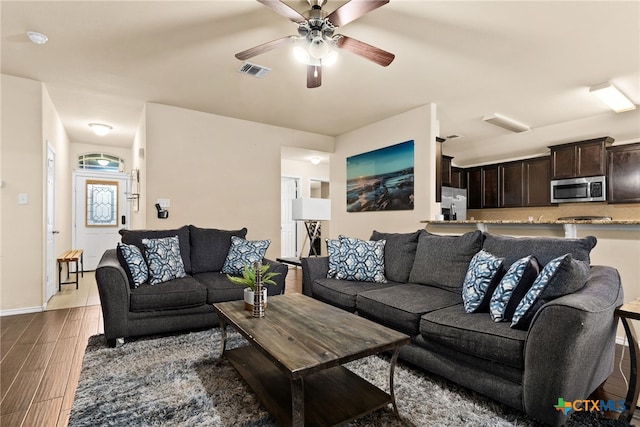 living room with ceiling fan