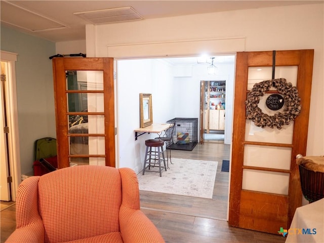 interior space featuring visible vents and wood finished floors