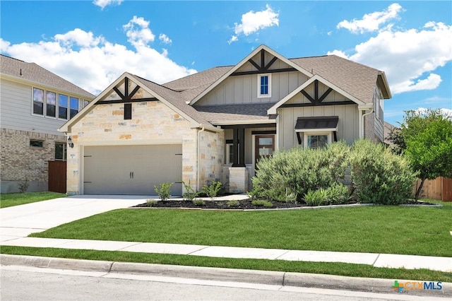 view of front facade featuring a garage and a front lawn