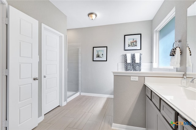 bathroom with vanity and walk in shower