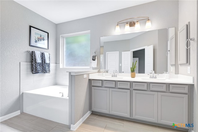 bathroom featuring a bathing tub and vanity