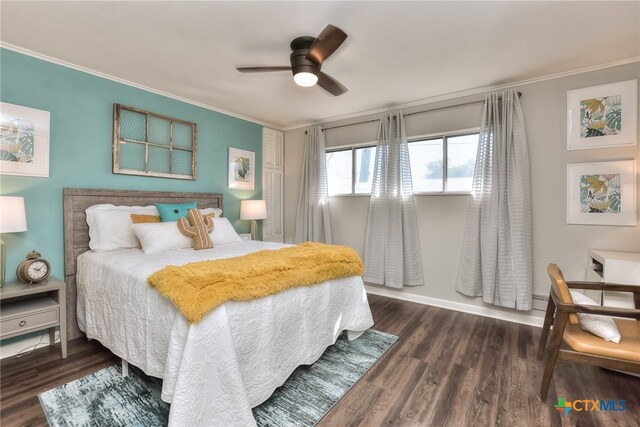 bedroom with ceiling fan, dark hardwood / wood-style floors, and ornamental molding