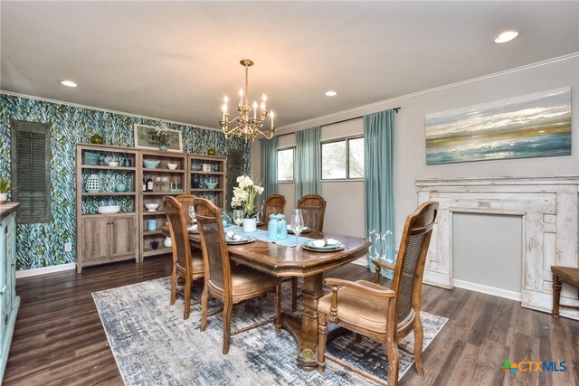 dining space featuring ornamental molding, dark wood-type flooring, and a notable chandelier