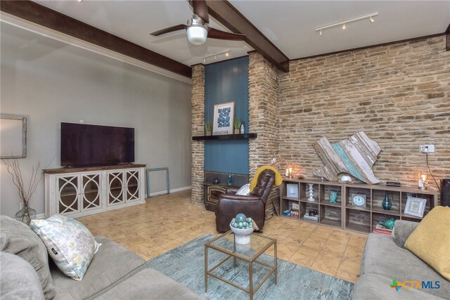 living room featuring beam ceiling, ceiling fan, and track lighting