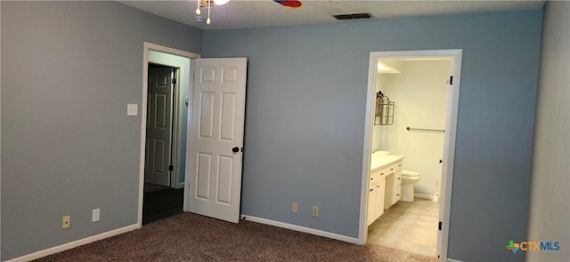 217 Taylors Dr, Temple, TX 76502 - unfurnished bedroom featuring carpet flooring, ensuite bathroom, and baseboards