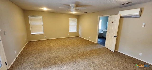 217 Taylors Dr, Temple, TX 76502 - unfurnished bedroom featuring a wall mounted air conditioner, carpet floors, baseboards, and connected bathroom