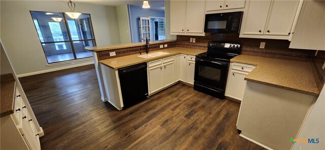217 Taylors Dr, Temple, TX 76502 - kitchen with black appliances, a peninsula, a sink, and dark wood-type flooring