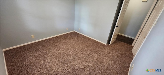 217 Taylors Dr, Temple, TX 76502 - unfurnished bedroom with dark carpet and baseboards