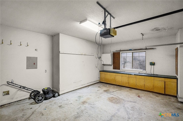 garage featuring a garage door opener and electric panel