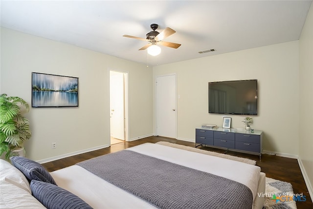 bedroom with dark wood-type flooring and ceiling fan