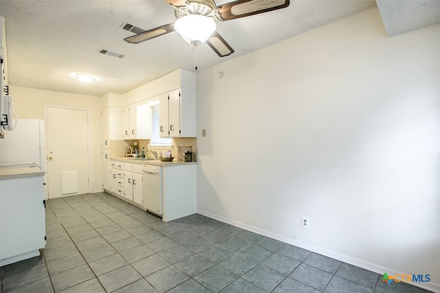 kitchen with white cabinets, light tile patterned floors, sink, ceiling fan, and white appliances