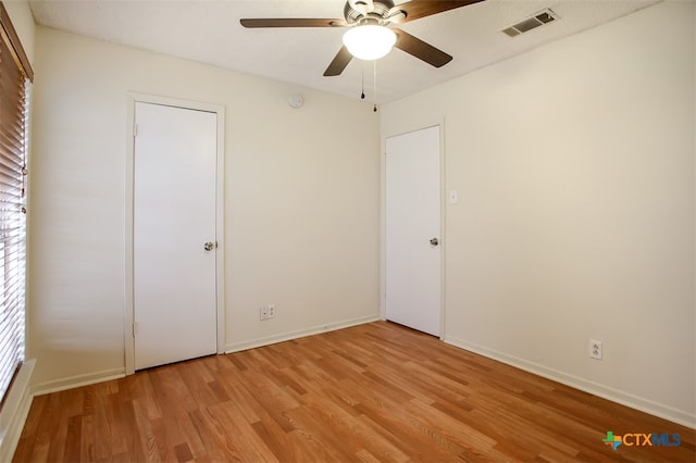 unfurnished bedroom featuring light hardwood / wood-style flooring and ceiling fan