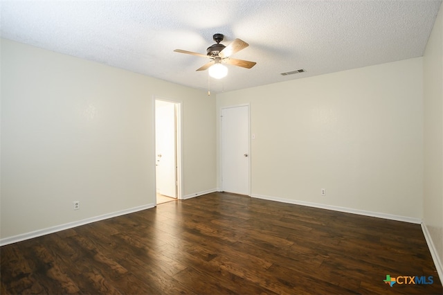 unfurnished room featuring dark wood-type flooring, a textured ceiling, and ceiling fan