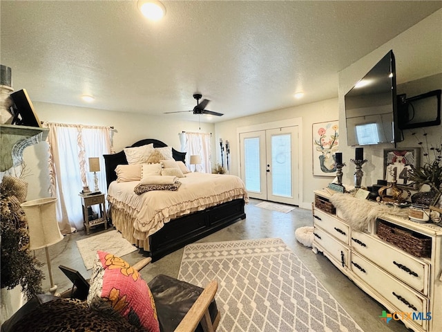 bedroom with access to outside, a textured ceiling, a ceiling fan, and finished concrete flooring