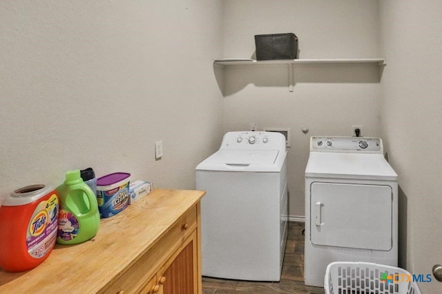 washroom with washer and clothes dryer, dark hardwood / wood-style flooring, and cabinets